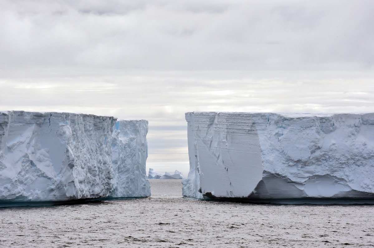 Tabular ice bergs are fractured segment of continental glacial ice. Shown above is part of the B15Y glacier. Above the water, they are sections with gaps in between. But below, they are all connected to a single base that is 17km long.