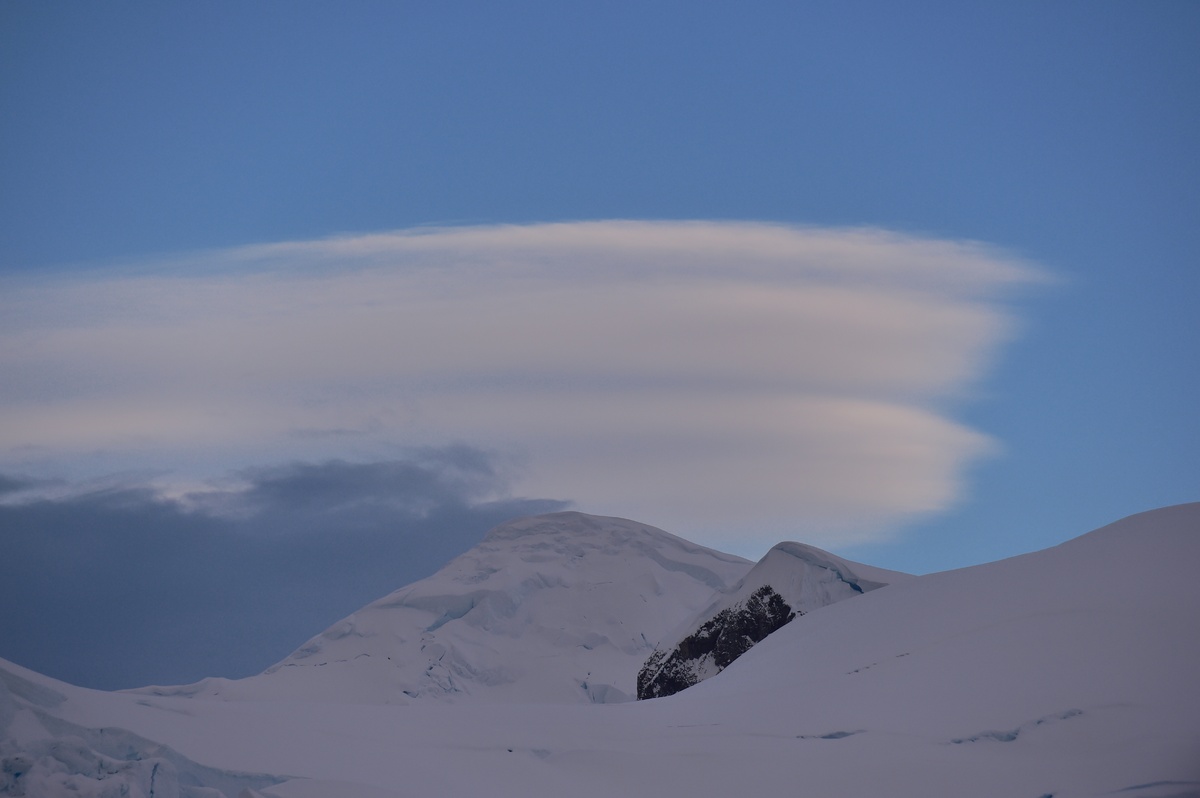 Lenticular clouds provide a good backdrop the mountain line.